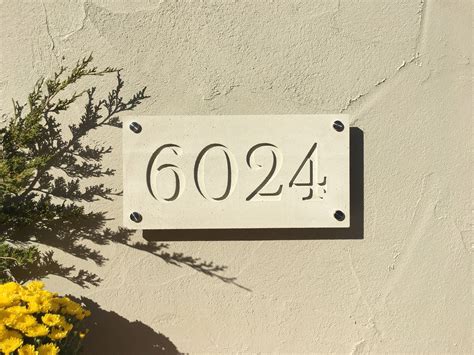 modern house numbers on stone